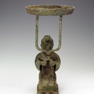 Bronze lamp with the shape of a man sitting on heels